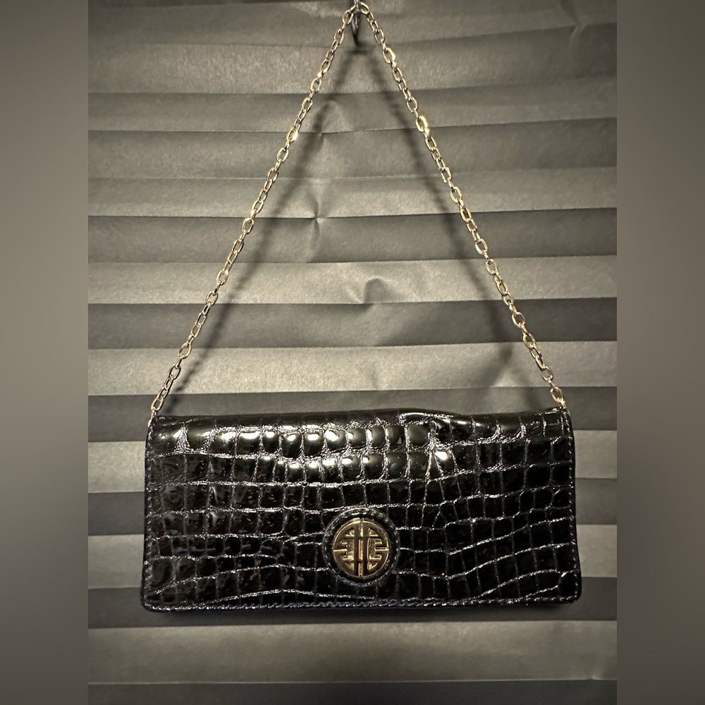 Black crocodile-embossed leather clutch by the brand Antonio Melani.
